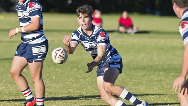 Shaun Packer offloads during the match between St Mary's and Wavell State High School last year.