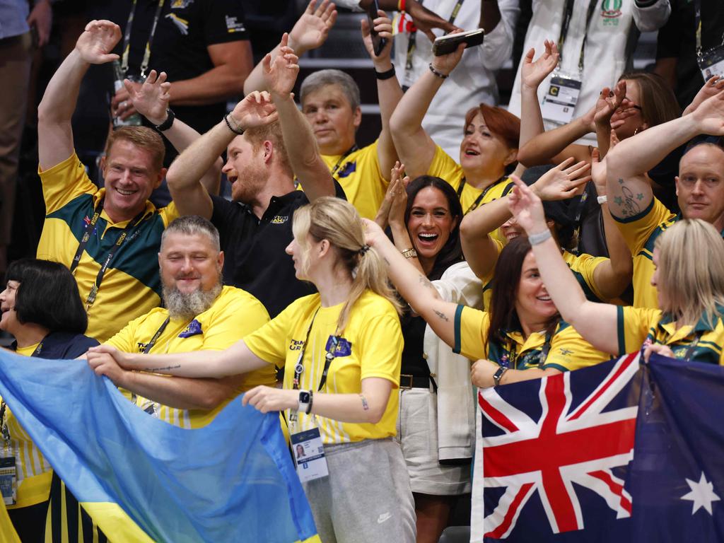The couple happily mingled with members of the Australian and Ukrainian teams. Picture: AFP
