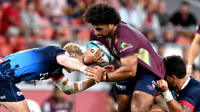 BRISBANE, AUSTRALIA - FEBRUARY 19: Zane Nonggorr of the Reds takes on the defence during the round one Super Rugby Pacific match between the Queensland Reds and the Melbourne Rebels at Suncorp Stadium on February 19, 2022 in Brisbane, Australia. (Photo by Bradley Kanaris/Getty Images)