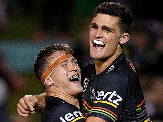 Nathan Cleary of the Panthers (right) celebrates with Mitchell Kenny after scoring a try during the Round 18 NRL match between the Penrith Panthers and the St George Illawarra Dragons at Panthers Stadium in Sydney, Friday, July 19, 2019. (AAP Image/Dan Himbrechts) NO ARCHIVING, EDITORIAL USE ONLY