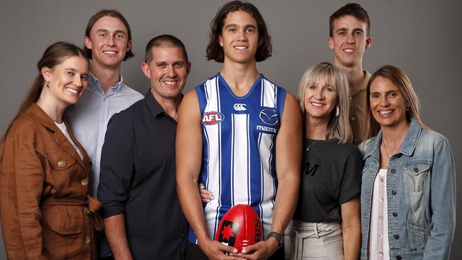 Flynn Perez poses with his family after being drafted by North Melbourne.