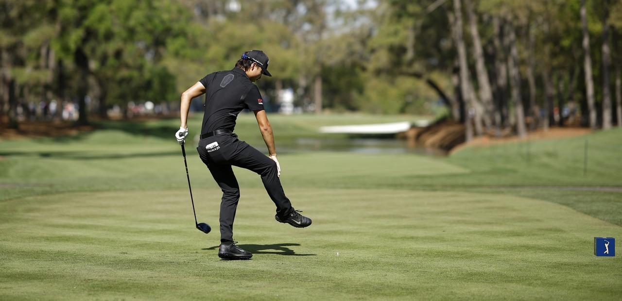 Min Woo Lee holds his calf after cramping. Picture: C. Tilton/Getty Images/AFP