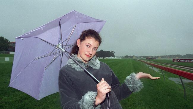 Jennifer Hand, daughter of secretary of the Geelong Racing Club, out on the course after the 2000 Geelong Cup meeting was abandoned due to the weather.