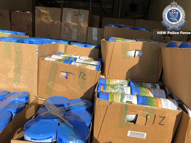 Police located more than 4000 tins of baby formula, large quantities of vitamins, Manuka honey, and various other items, all of which are believed to be stolen. Picture: NSW Police