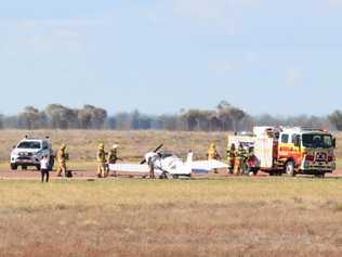 Firefighters at scene of plane fire on side of Landsborough Highway at Longreach Airport. Photo by Greg Weir / CQ Plane Spotting Blog