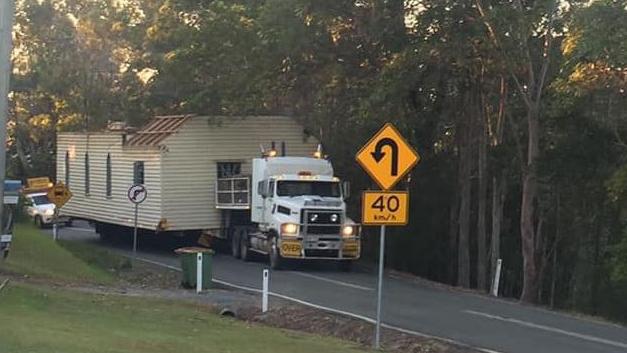 The truck carrying the old church became stuck at an intersection while travelling up a hill at Beechmont. Picture: Facebook - Beechmont Community Network