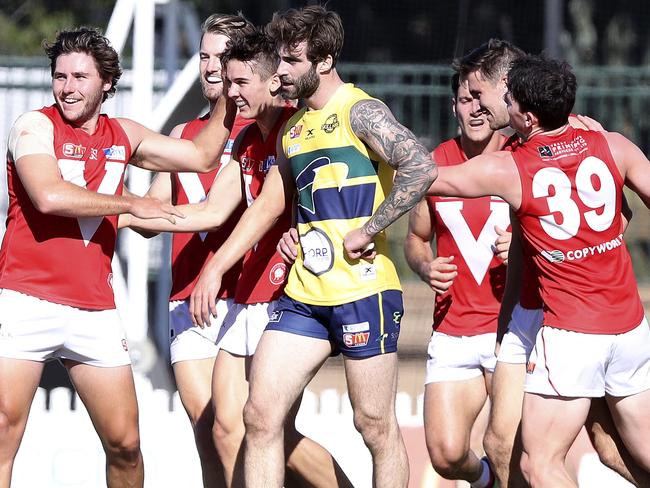 29/04/18 - SANFL - Eagles v North Adelaide at Woodville Oval. Jack Firns not impressed about being in the middle of North's goal celebrations . Picture SARAH REED