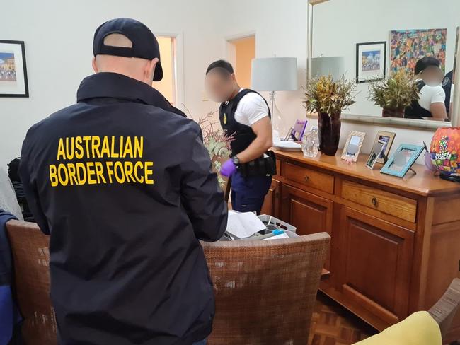 Investigator searching the home in Alkoomie Ave, Forestville. Picture: AFP