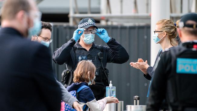 Passengers are loaded onto buses headed to the Pullman Hotel in Adelaide where they will quarantine for 14 days. Photo: The Advertiser/ Morgan Sette.