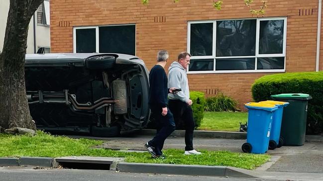 Michael Voss leaves the scene with cafe owner James Laskie after chasing down the teen.