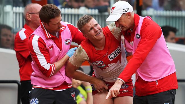 Dan Hannebery is helped off by trainers during the AFL Grand Final. Picture: Phil Hillyard