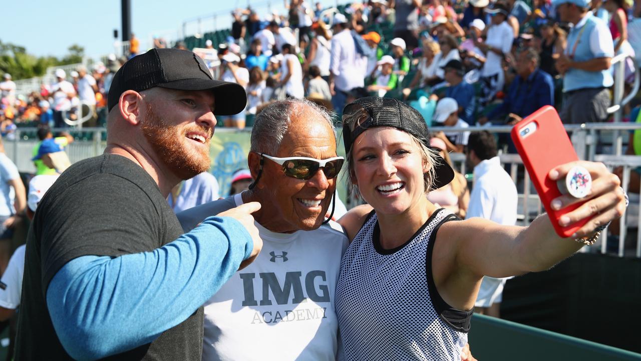 Bethanie Matek Sands of the United States takes a selfie with tennis coach Nick Bollettieri. Photo by Clive Brunskill/Getty Images.