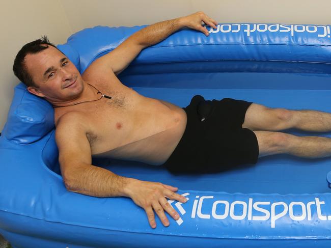 Leading jockey Jason Taylor tries out the Ice Bath in the recovery centre at Gold coast Turf Club. Picture Glenn Hampson
