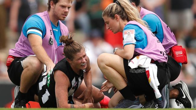 Bri Davey is helped by trainers after suffering a leg injury. Picture: Getty Images.