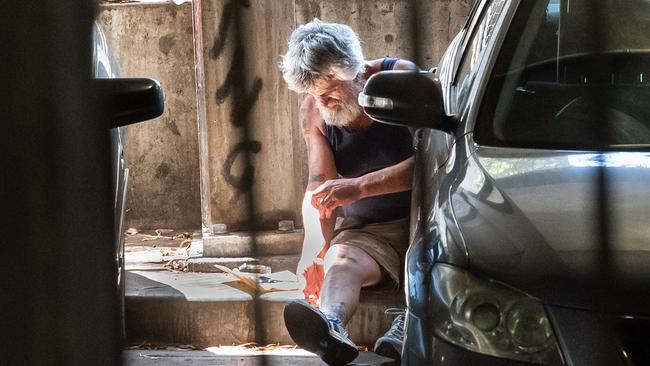 A man injects in a multi-level car park next to the Richmond safe injecting room. Picture: Jason Edwards