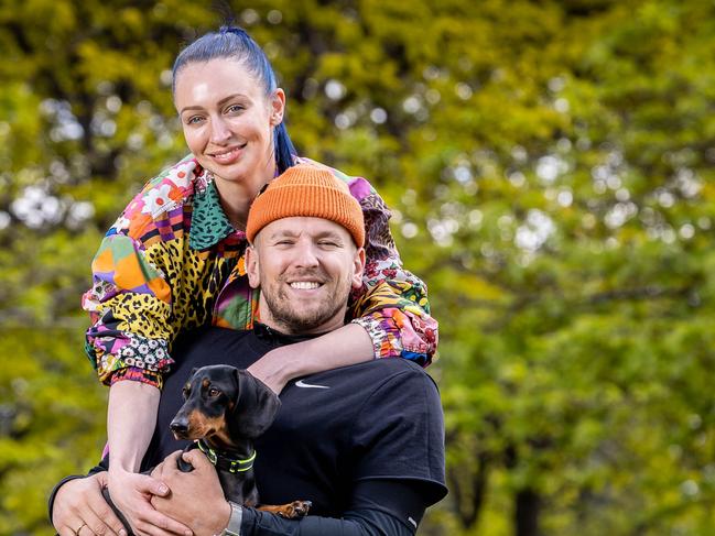 Wheelchair tennis champion Dylan Alcott, is reunited with his girlfriend Chantelle Otten and their dog Sauce after months apart. Picture: Jake Nowakowski