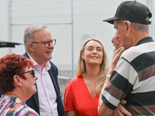 Senator Anne Urquhart, Prime Minister Anthony Albanese and his partner Jodie Haydon talking to Petuna founder Peter Rockliff, at a community barbecue at the salmon company’s East Devonport site. Picture: NewsWire/Scott Gelston