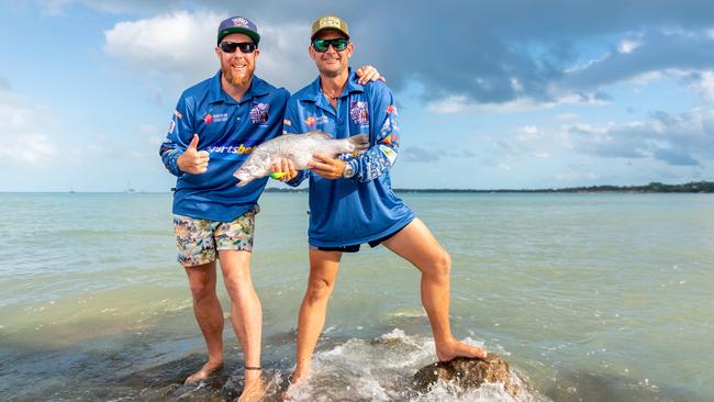 Mackay fisho Ryan Curtis caught a double tagged barra, giving $5000 to his friend Warren Franklin. Photograph: Che Chorley