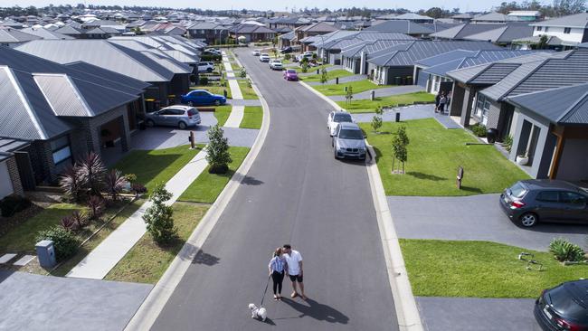 Get a job, they said. Get a house, they said. Live the dream, they said. Maria and husband Adrian in their Gregory Hills home in Sydneys West. Picture's Darren Leigh Roberts