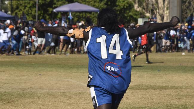 Barry Ullungura celebrating on the final siren in the Tiwi Island Football League grand final between the Tuyu Buffaloes and the Pumarali Thunder. Picture: Max Hatzoglou