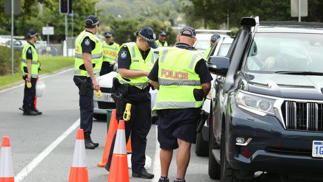 Police perform a random breath testing operation.