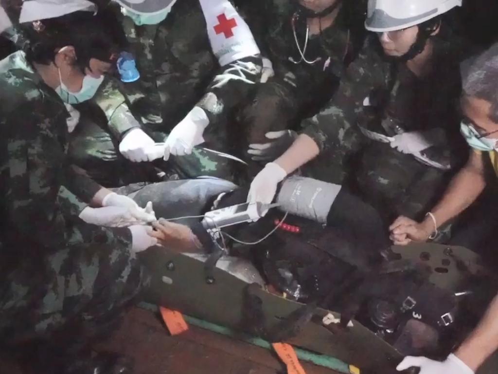 A member of the Wild Boars Thai youth football team is moved on a stretcher during a rescue operation inside a flooded cave in Thailand. Picture: AFP