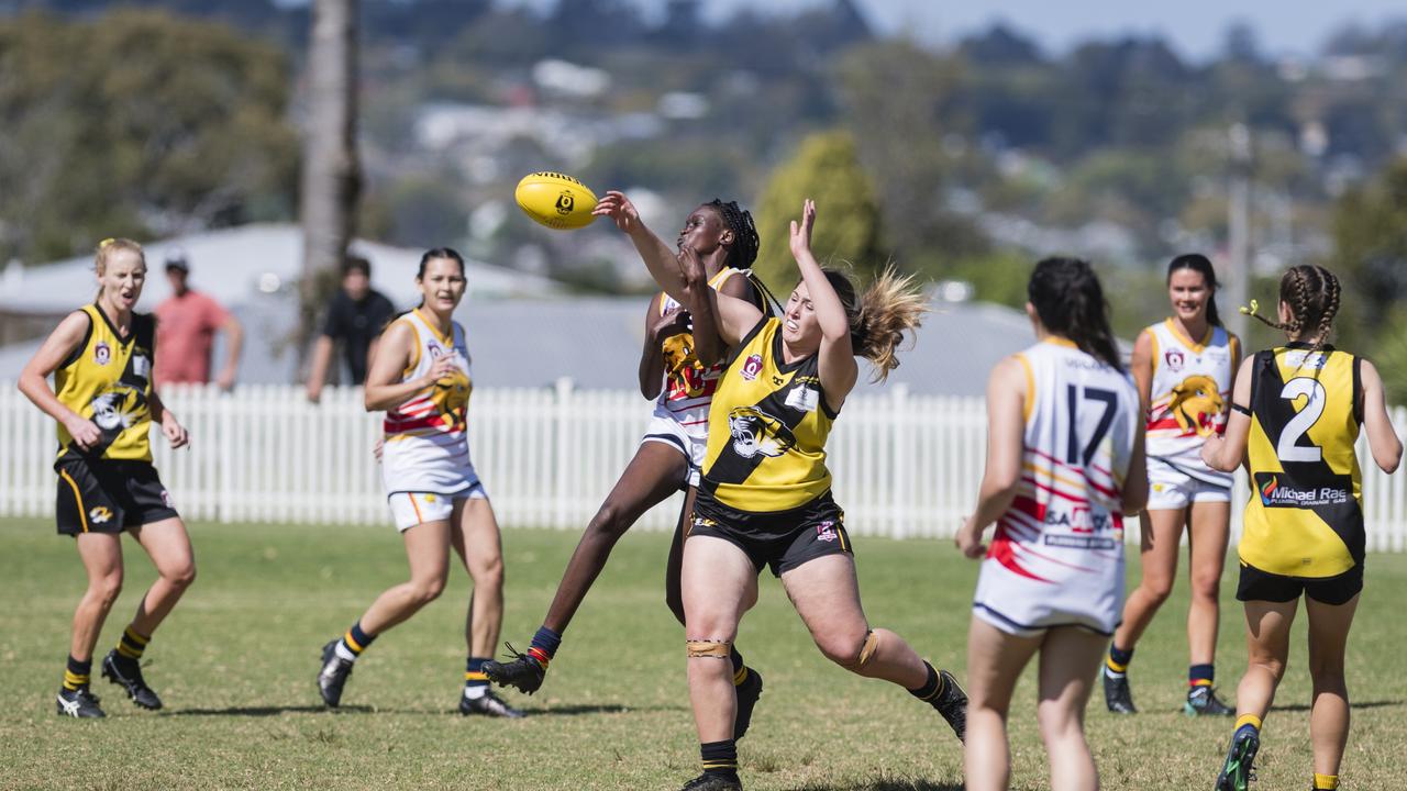 Apajok Deng (left) of University Cougars battles for possession with Charlotte Artavilla-Bennett of Toowoomba Tigers in AFL Darling Downs Toowoomba Toyota Cup senior women grand final at Rockville Park, Saturday, September 2, 2023. Picture: Kevin Farmer