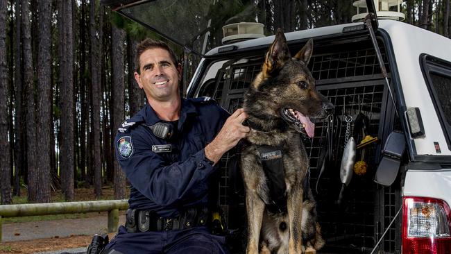 Senior Constable Nick Donald with his reliable partner PD Hondo. Picture: Jerad Williams