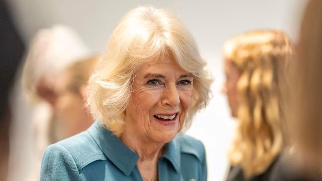 Britain's Queen Camilla (C) talks with volunteers and visitors to the centre after officially opening 'Maggie's Royal Free', a new cancer support centre, at the Royal Free Hospital in east London on January 31, 2024. (Photo by Paul Grover / POOL / AFP)