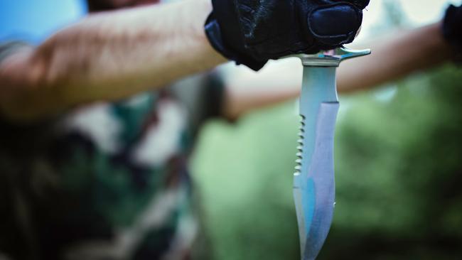 The man was found with a large ‘Rambo-style’ knife stuck in his shoulder. 