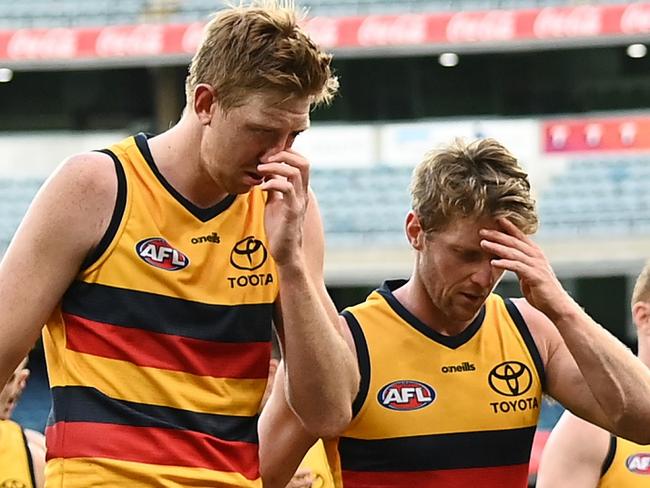 MELBOURNE, AUSTRALIA - AUGUST 15: The Crows look dejected after losing the round 22 AFL match between Melbourne Demons and Adelaide Crows at Melbourne Cricket Ground on August 15, 2021 in Melbourne, Australia. (Photo by Quinn Rooney/Getty Images)