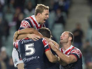 Mitchell Aubusson (left) and Boyd Cordner of the Roosters celebrate try and match winner by Latrell Mitchell during the NRL qualifying final between the Sydney Roosters and the Brisbane Broncos at Allianz Stadium in Sydney, Friday, September 8, 2017. (AAP Image/Craig Golding) NO ARCHIVING, EDITORIAL USE ONLY