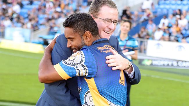 Graham Annesley embracing club legend Preston Campbell after the club this year named a stand after the foundation player. Photo by Richard Gosling