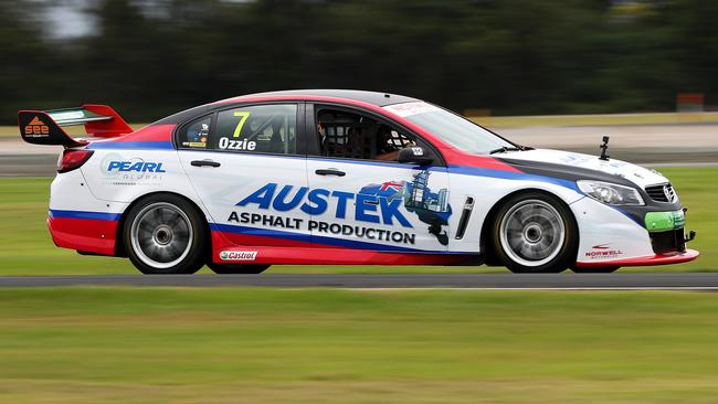 Motor racing identity Paul Morris test-driving a new bitumen made from recycled tyres. Picture: NIGEL HALLETT