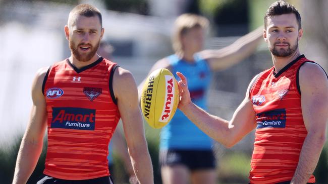 Dyson Heppell’s (left) leadership has shone while in rehabilition in the Gold Coast hub. Picture: Michael Klein