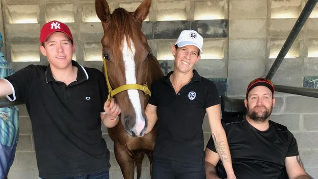 Johnston with son Will, who rides trackwork, and jockey partner Natalea Summers.