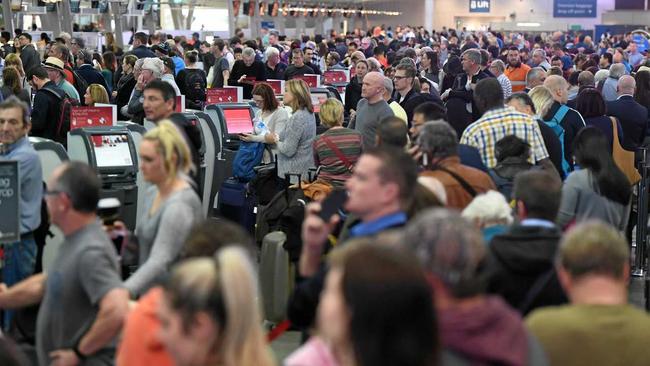 Huge queues at Sydney Airports T2 Domestic Terminal as passengers are subjected to increased security, Sydney, Australia, Monday, July 31, 2017. Airline passengers are experiencing long delays at Australian airports as security is beefed up following a number of terror raids over the weekend. Picture: DEAN LEWINS