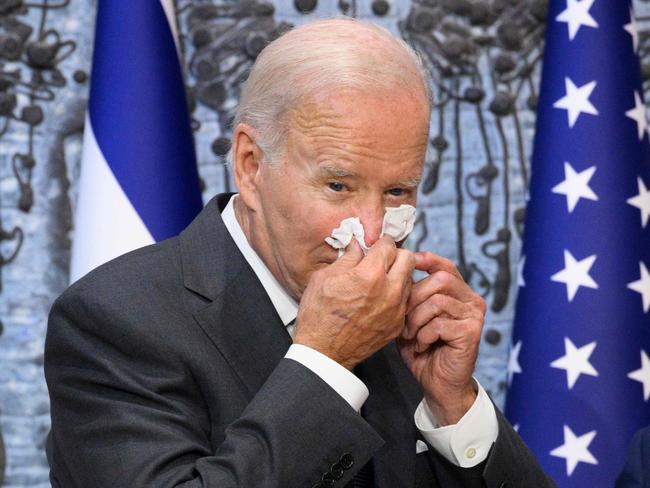 US President Joe Biden wipes his nose while suffering from Covid-19. Picture: AFP