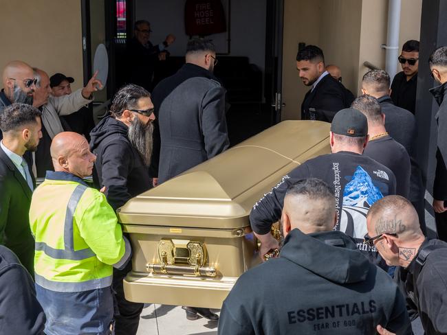 The boxer’s coffin is carried into the mosque. Picture: David Geraghty