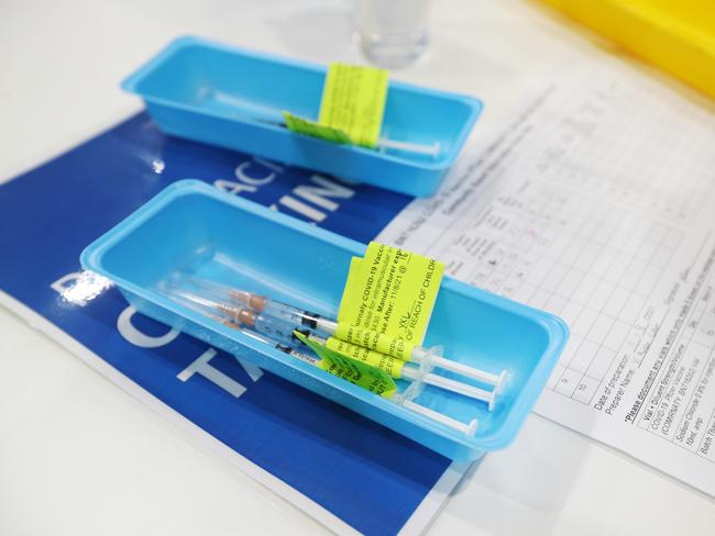 BRISBANE, AUSTRALIA - AUGUST 11:  Pfizer vials are seen on the opening day of the COVID-19 vaccination hub at Brisbane Convention and Exhibition Centre on August 11, 2021 in Brisbane, Australia. The vaccination hub will provide the Pfizer vaccine and second dose of AstraZeneca to individuals with bookings as Queensland opens the vaccine registration list state-wide to anyone over 16. The Australian government says 70% of eligible Australians must be fully vaccinated before the country reopens. (Photo by Tara Croser - Pool/Getty Images)