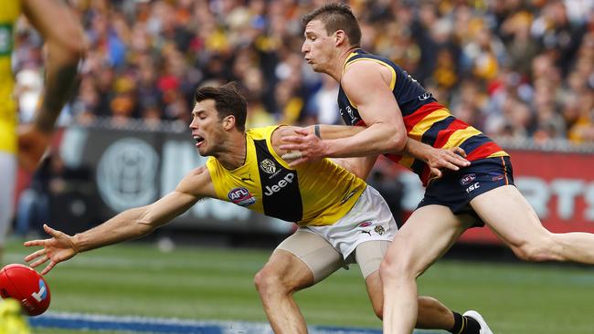 Alex Rance keeps the ball away from Josh Jenkins. Picture: Michael Klein