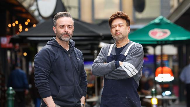 Degraves St traders Johnny Sandish (right) from XpressoMondo and Theo (left) from The Quarter. Picture: Brendan Beckett