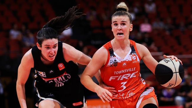 Steph Reid of the Fire drives to the basket during the WNBL match between Sydney Flames and Townsville Fire at Qudos Bank Arena, on December 29, 2023, in Sydney, Australia. (Photo by Mark Evans/Getty Images)