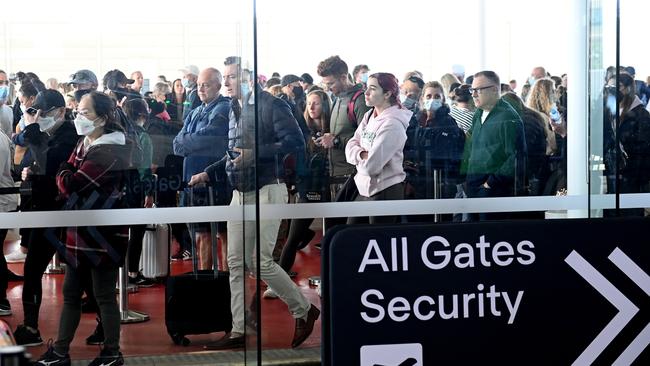 Sydney Airport travellers wait in large queues at the domestic departure terminal. Picture: Jeremy Piper/NCA NewsWire