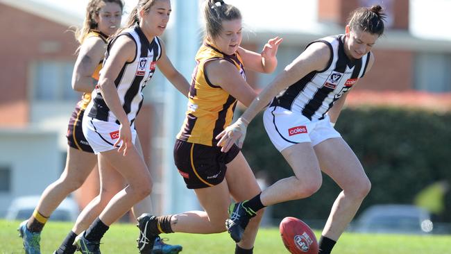 Hawthorn and Collingwood VFL W players battle it out last season.