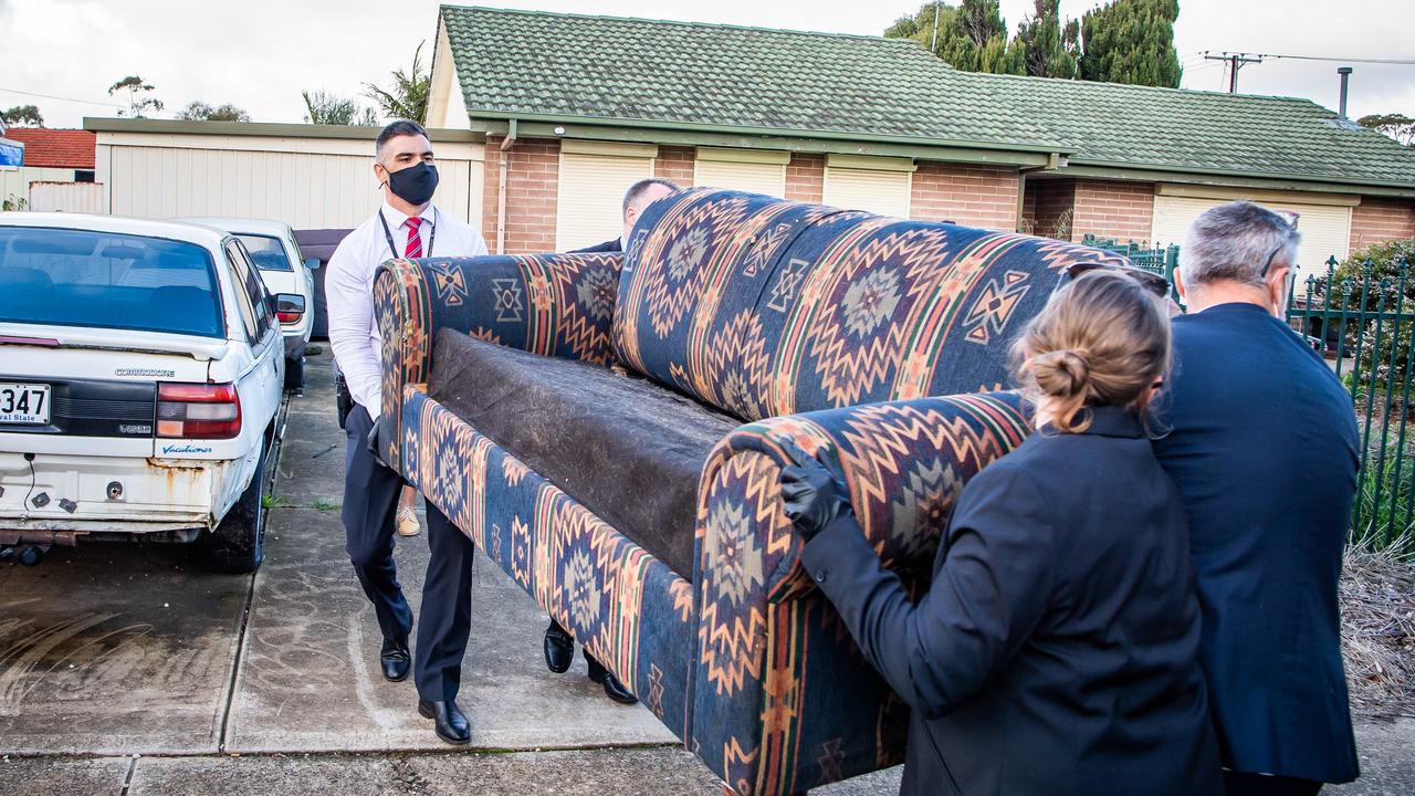 Major Crime detectives recover a sofa from a home in Christie Downs. Picture: Tom Huntley