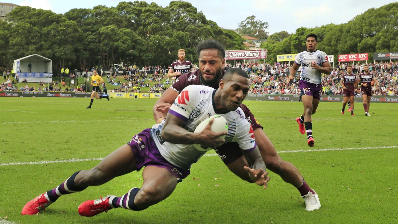 Suliasi Vunivalu of the Storm scores a try against Manly