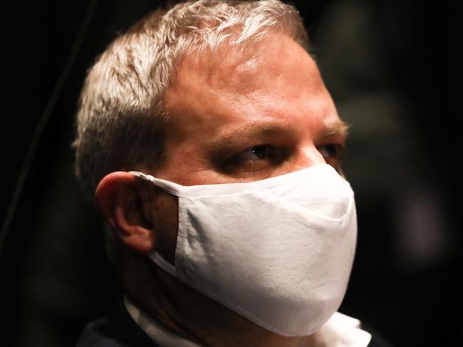 MELBOURNE, AUSTRALIA - JULY 24: Victoria's Chief Health Officer Professor Brett Sutton is seen wearing a mask during a press conference on July 24, 2020 in Melbourne, Australia. Premier Daniel Andrews confirmed 300 new coronavirus cases and six new deaths. Face masks or face coverings are now mandatory for anyone leaving their homes in the Melbourne metropolitan area or the Mitchell Shire. The new rule into effect on Thursday 23 July, and anyone failing to wear a mask in public can receive a $200 fine. Metropolitan Melbourne and the Mitchell shire remain in lockdown due to the rise in COVID-19 cases through community transmissions, with residents in lockdown areas under stay at home orders until 19 August. People are only able to leave home have for exercise or work, to buy essential items including food or to access childcare and healthcare. (Photo by Asanka Ratnayake/Getty Images)