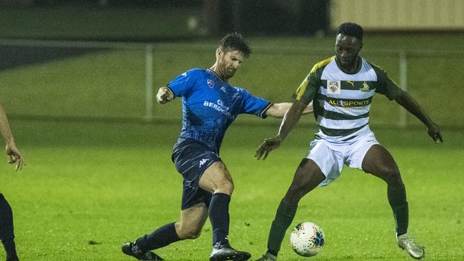 Brenton Pennells (left) of South West Queensland Thunder and Attilio Asante of Ipswich Pride in FQPL1 round six football at Clive Berghofer Stadium, Saturday, May 1, 2021. Picture: Kevin Farmer