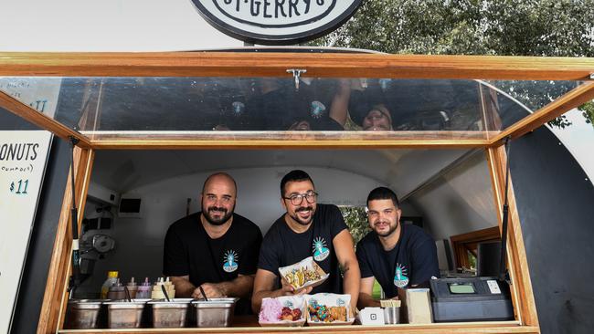 Dean Giannakis owner of St Gerrys food truck in Caulfield Park with left Manos Maroudis and right Michal Zapantis before coronavirus restrictions stopped festival business. Photo: Penny Stephens